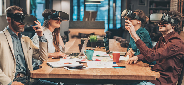 Small group of people using virtual reality headsets Small group of people using virtual reality headsets